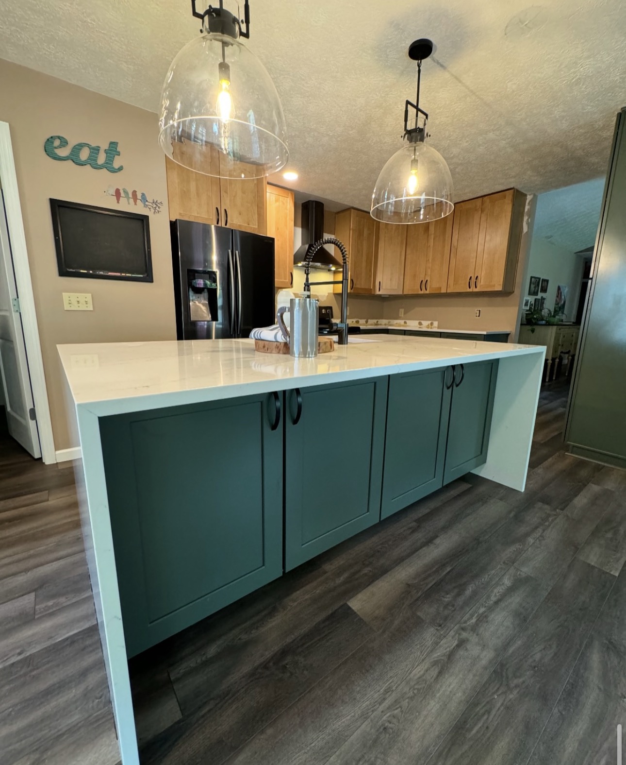 Full kitchen renovation with updated cabinets, quartz countertops, and new flooring in Northeast Ohio