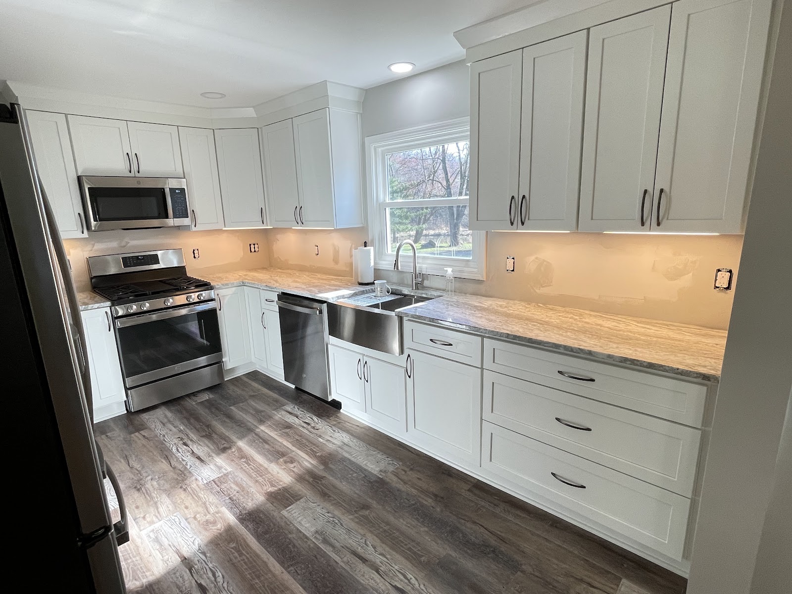Kitchen renovation with custom cabinetry, granite countertops, and hardwood floors in Northeast Ohio