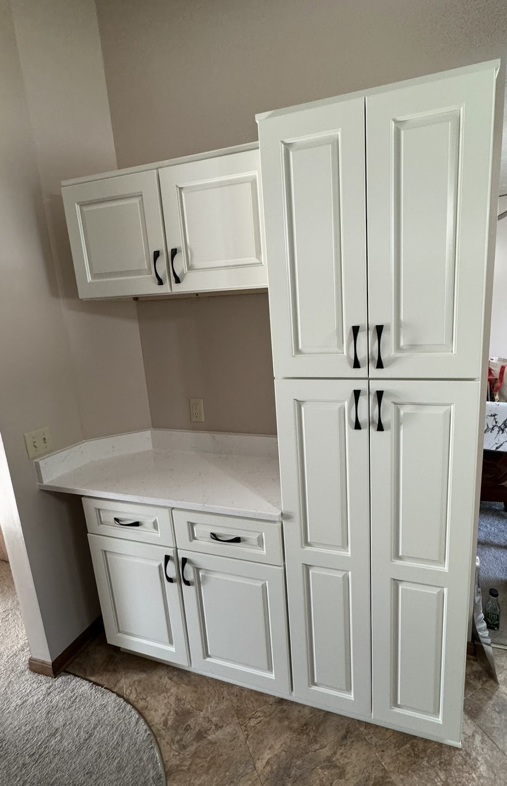 Kitchen renovation with updated cabinets, countertops, and backsplash tile in Lake County Ohio