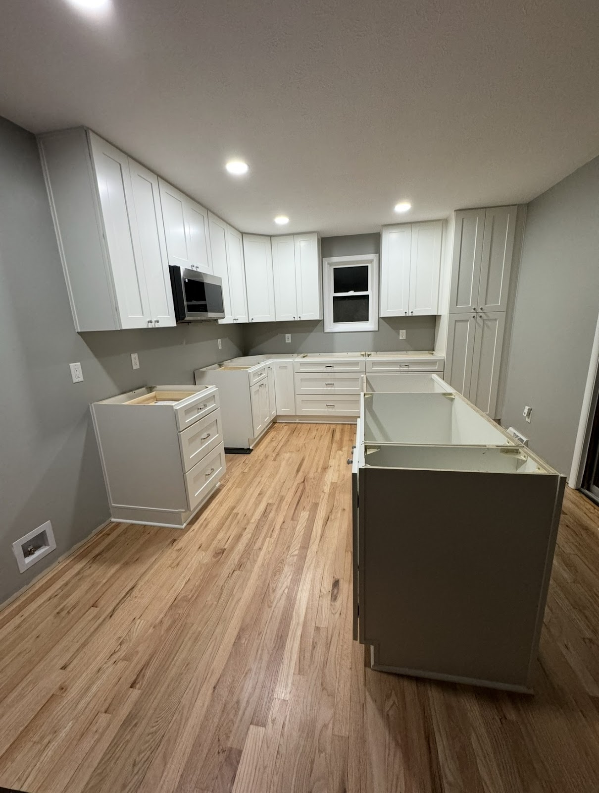 Kitchen remodel with two-tone cabinetry and Calacatta quartz countertops in Lake County Ohio