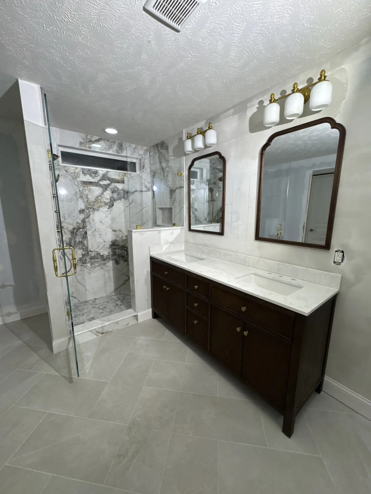 Marble shower and double vanity bathroom remodel by Specialty Home Remodeling