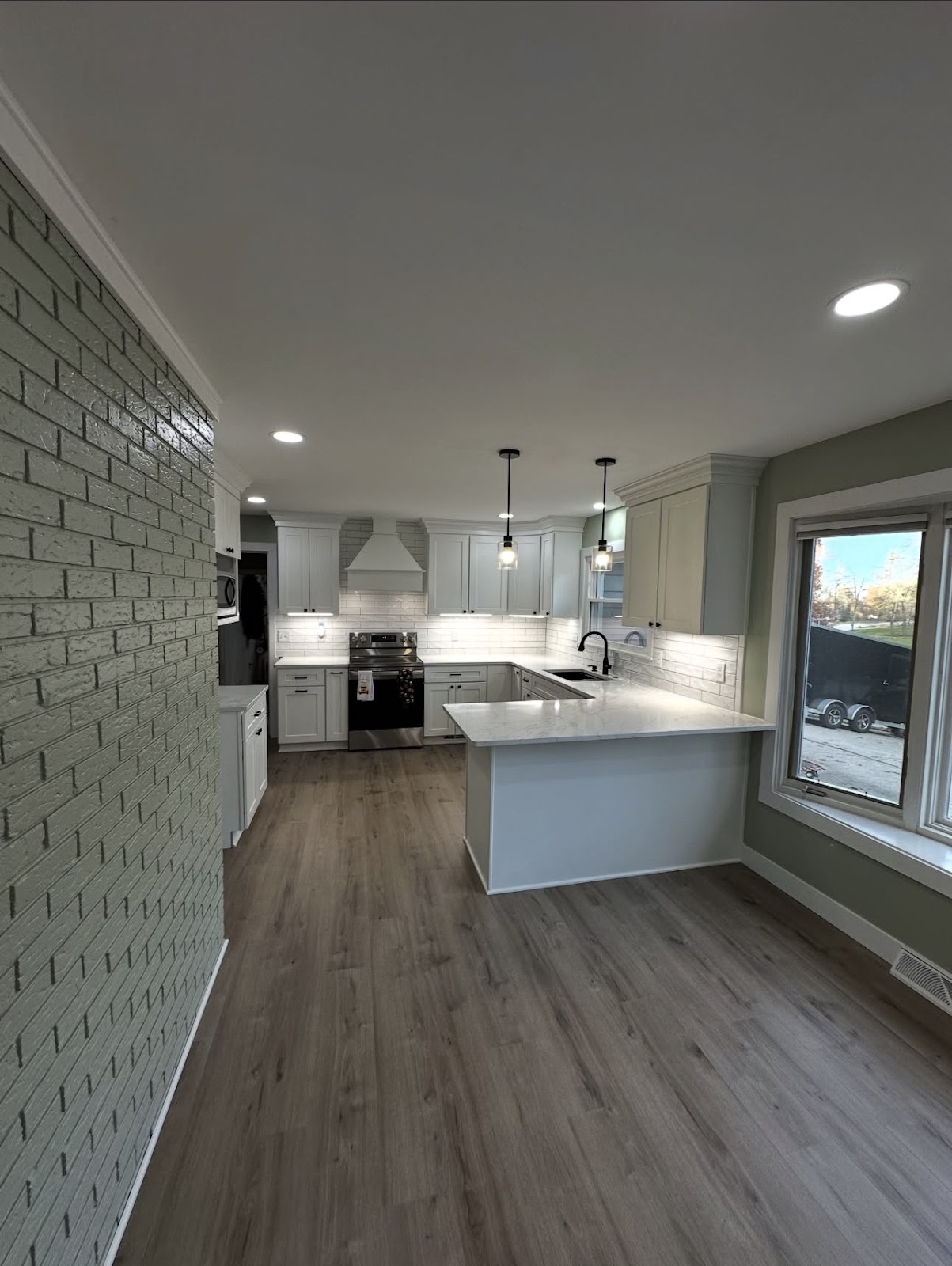 Full kitchen renovation with updated cabinetry, countertops, and backsplash in Lake County Ohio