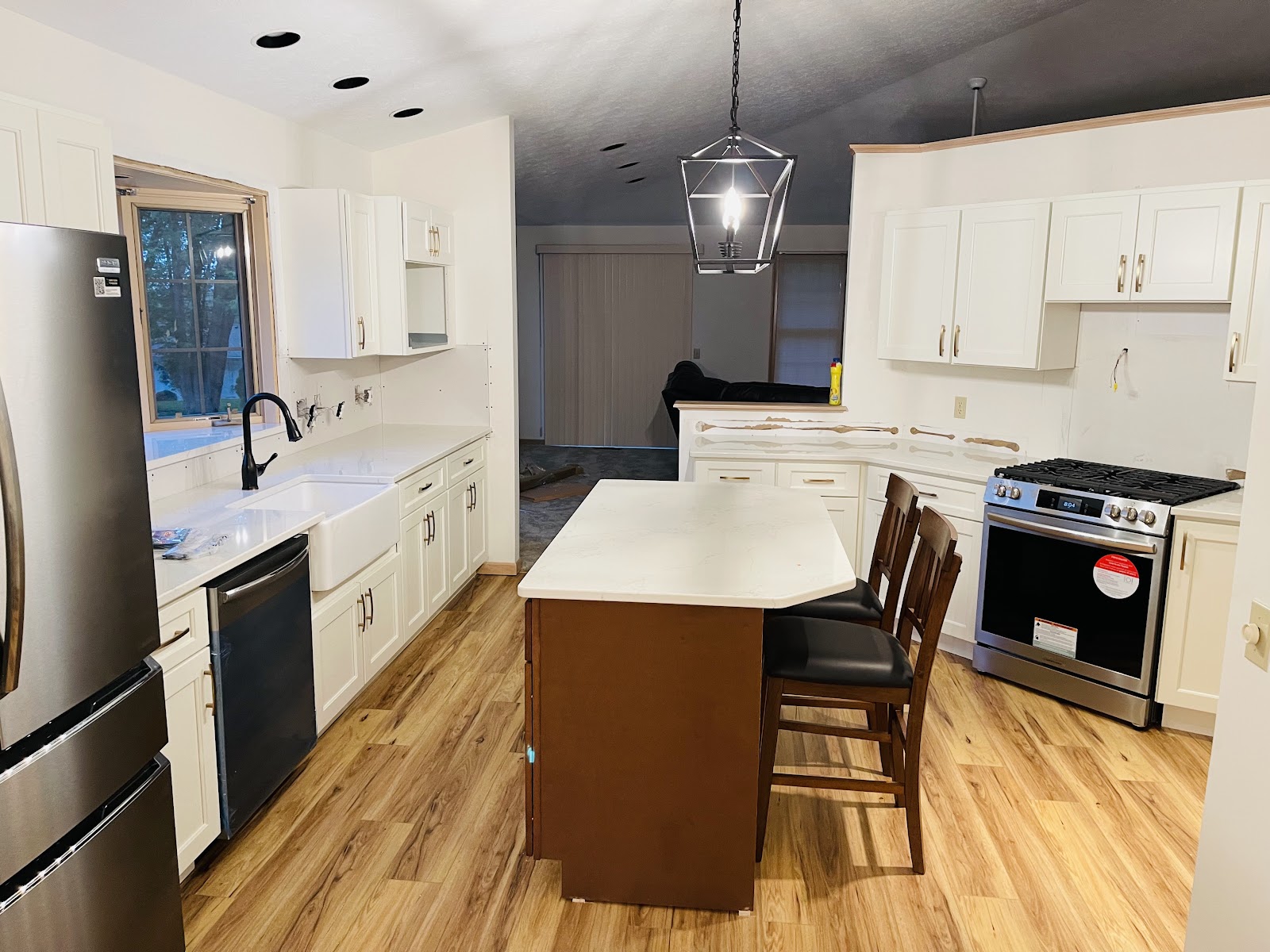 Kitchen renovation with custom cabinets, stone countertops, and tile backsplash in Northeast Ohio