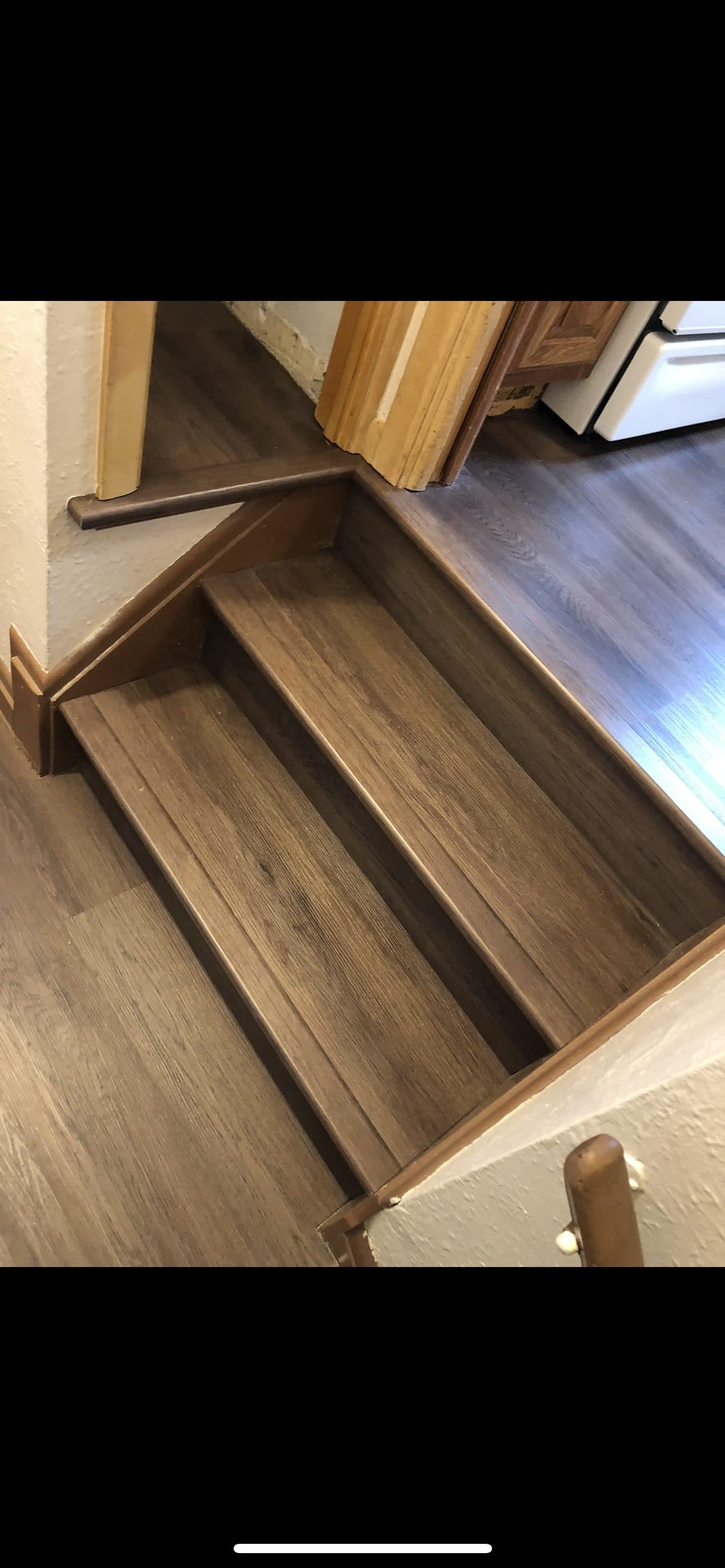 Luxury vinyl plank flooring installation on staircase and landing in Northeast Ohio home
