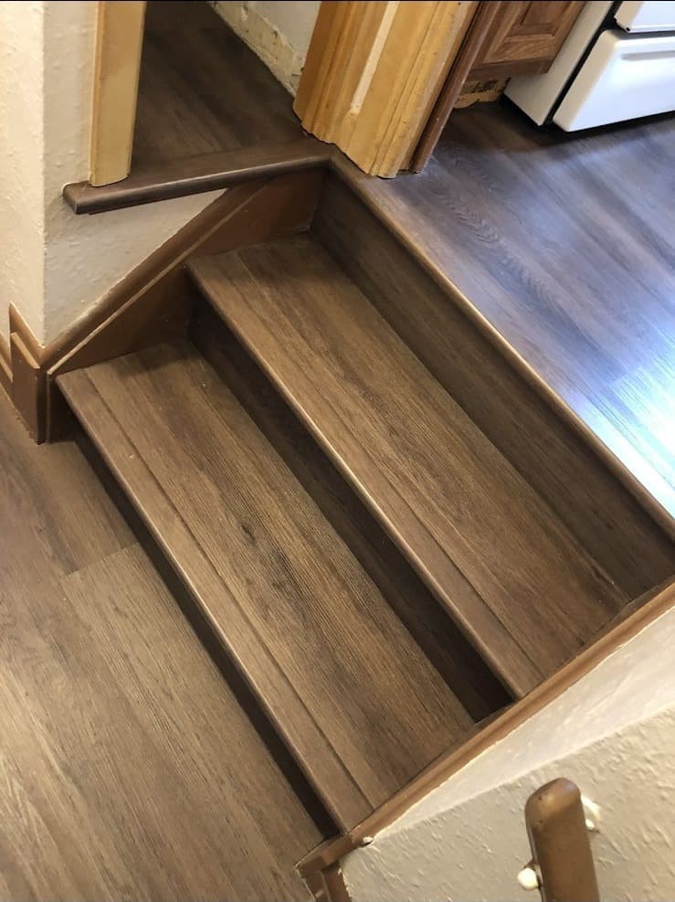 LVP hardwood flooring installation on stairs and landing in Lake County Ohio home